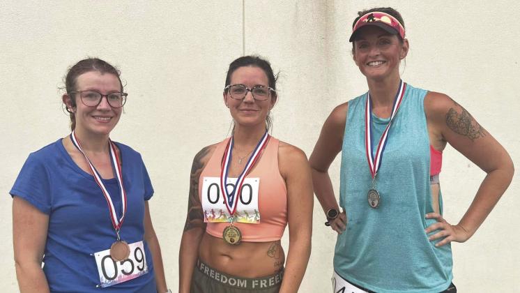 The top three runners in the women’s division were (l-r) Chelsie Kubiak, third place; Lexi Christensen, first place; and Shay Mullins, second place.