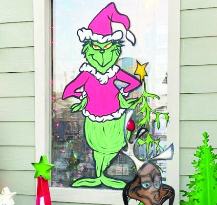 Artist Angela Beene won first place in the window painting category of the Pauls Valley Chamber of Commerce's window decorating contest for her artwork at Bloomin' Crazy.