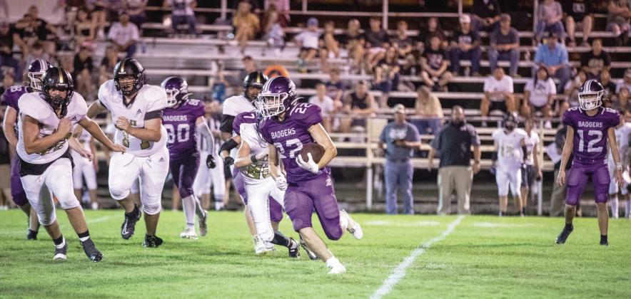 Elmore City-Pernell’s Cason Johnson tries to run around the defensive edge of the Allen Mustangs in Friday's 47-30 loss. The Badgers fought a tough game and look to rebound as they travel to District 2A-4 Tishomingo on September 16. Photo by Jake Faucett