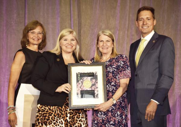 Chickasaw Country was recently honored for efforts to boost tourism in Oklahoma. The RedBud Awards represent the highest honor in the Oklahoma tourism industry. Pictured from left to right, Jenifer Reynolds, Discover Oklahoma; Paige Williams Shepherd, Ed.D., Chickasaw Nation Director of Corporate Development and Tourism; Angel Green, Chickasaw Country Senior Manager Tourism Sales and Marketing; and Oklahoma Lt. Governor Matt Pinnell.