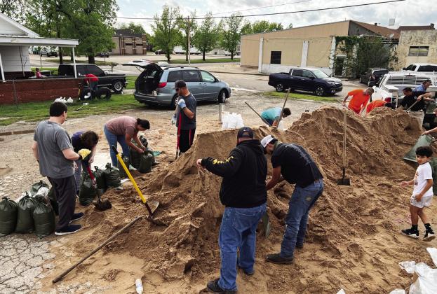 Local residents filled sandbags at the PV Fire Station Wednesday afternoon as they prepared to protect their homes and businesses against potential flooding as rivers and creeks in the area were forecast to reach flood stage following heavy rainfall this week. 