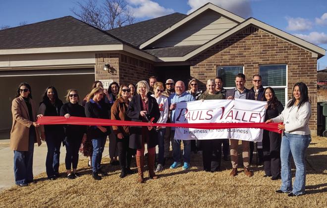The Pauls Valley Chamber of Commerce welcomed new member Laguna Management Services with a ribbon cutting Wednesday. The company just completed the 26-home Rush Creek Valley housing development in Pauls Valley, and Wednesday marked the addition’s grand opening. Photo courtesy of Pauls Valley Chamber of Commerce