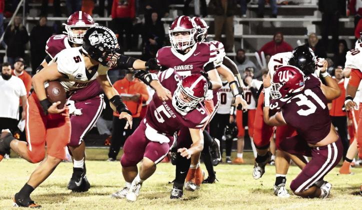 Wynnewood’s #70 Ismal Williams, #5 Jake Everett, #7 Chandler Appleton and #31 Coalten Kennedy chase the Pawhuska running back in Friday night’s season-ending 26-28 loss. The Savages had a great season, and the Garvin County News Star would like to congratulate them on their accomplishments. News Star photo by Don Coffey