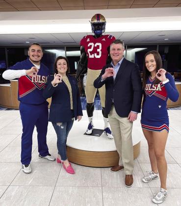 Sen. Jessica Garvin and Sen. James Leewright, R-Bristow, pose with members of the University of Tulsa’s cheer squad during a recent tour of the campus with Leadership Oklahoma.