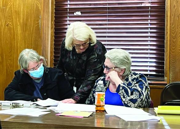 Garvin County Election Board Chair Pam Spaeth, Secretary Gayla Dean and Vice Chair Mary Bogan deliberating during hearings to decide contests of candidacy Feb. 16. News Star photo by Suzanne Mackey