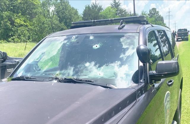 Multiple law enforcement vehicles were damaged during a standoff with an armed suspect Saturday afternoon. No officers were injured in the incident.