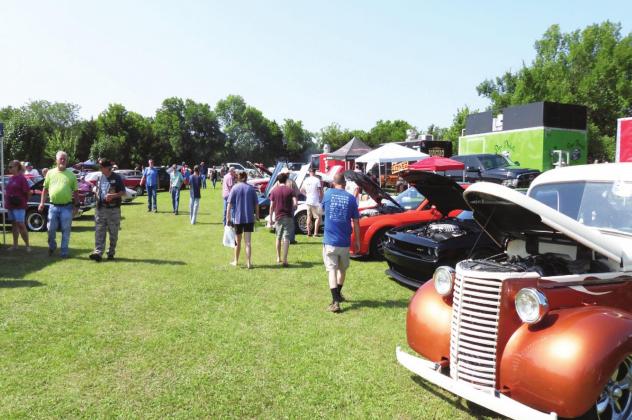 Spectators enjoying entries in last year's car show at the Stratford Peach Festival. The 2022 Stratford Peach Festival will be July 16. News Star photo by Chris Mackey