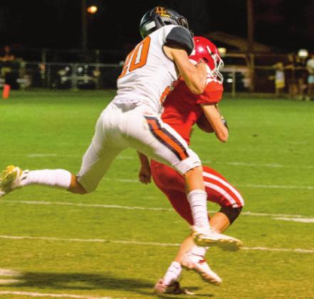 Andon Register tries to break up a pass to the Wolves receiver.
