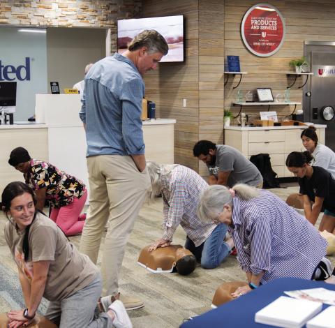 Community members practice their CPR skills during a recent CPR Certification class at First United Bank in Pauls Valley. The bank plans to offer the certification class to the community again in the spring. Photo courtesy of First United Bank