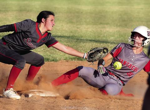 Pauls Valley’s Raegan Close takes a ball off the gut as she slides into third during action with Wynnewood Monday in the Wayne Festival. Photo by Mike Arie