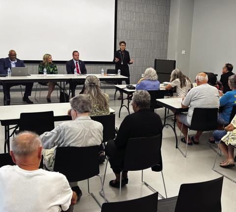 From left, Fairo Mitchell, director of the public utilities for the Oklahoma Corporation Commission, Joy McGill, state director of advocacy for AARP, State Rep. Brad Boles, R-Marlow, and Rep. Meloyde Blancett, D-Tulsa, at a town hall about electricity rates held Thursday, Aug. 13, 2026, at the Bronson Brookside Library in Tulsa.  Photo by Andrea Eger/Oklahoma Watch