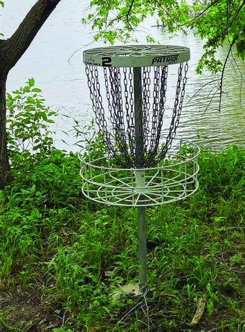 Northshore Disc Golf Course, one of two in Elmore City, is the most technical course in the county. Hole 2 is surrounded by the lake on three sides. News Star Photo by Jennifer Lindsey