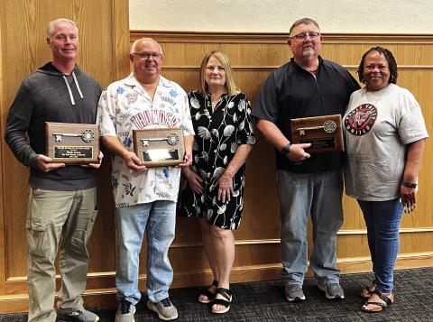 Pauls Valley educators Mark Green, Kirk Moore and Chad Chronister were presented with ceremonial Keys to the City of Pauls Valley Friday in recognition of their actions to protect students and staff at Pauls Valley High School from an armed intruder who entered the school and fired shots on April 7. Pictured left to right, Mark Green, Kirk Moore, PV Vice Mayor Bonnie Meisel, Chad Chronister and PV Mayor Jocelyn Rushing. News Star photo by Suzanne Mackey
