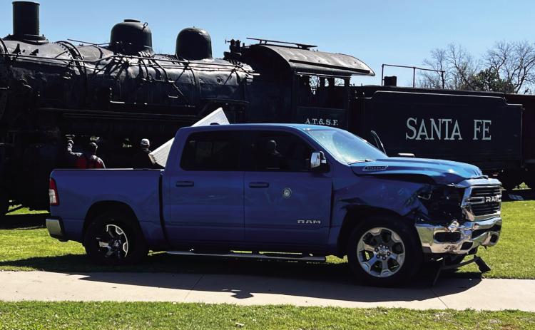 Pauls Valley’s Santa Fe Depot Park was the scene of a single-vehicle accident March 28, after a moment of inattention led to a driver crashing his pickup through the park’s brick and iron fencing. News Star photo by Suzanne Mackey