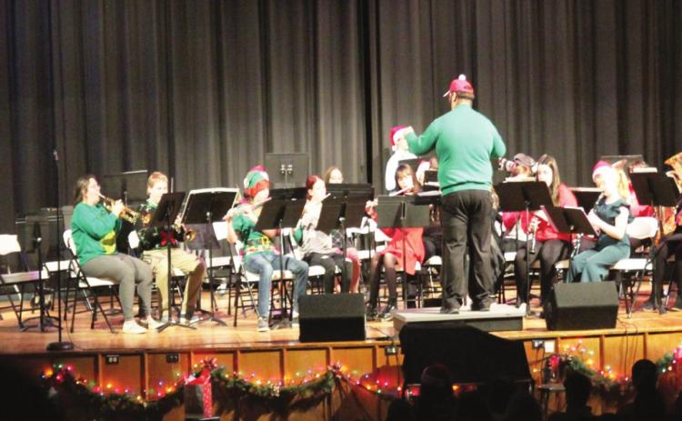 The Lindsay community was entertained by the beginning, advanced and high school bands at the high school auditorium on Tuesday evening, December 14. Mr. Watson, assistant band director, is pictured here directing the advanced band. Photo courtesy of Sheryl Kochert