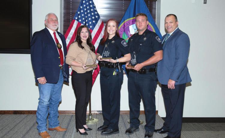 Pictured from left to right are Charlie Mackey, Oklahoma Sheriffs and Peace Officers Association; Meredeth Kueck, who accepted award on behalf of Michael Brown; Officer Sara Miller; Officer Kyler Truett; and Lighthorse Chief of Police Michael Manning.