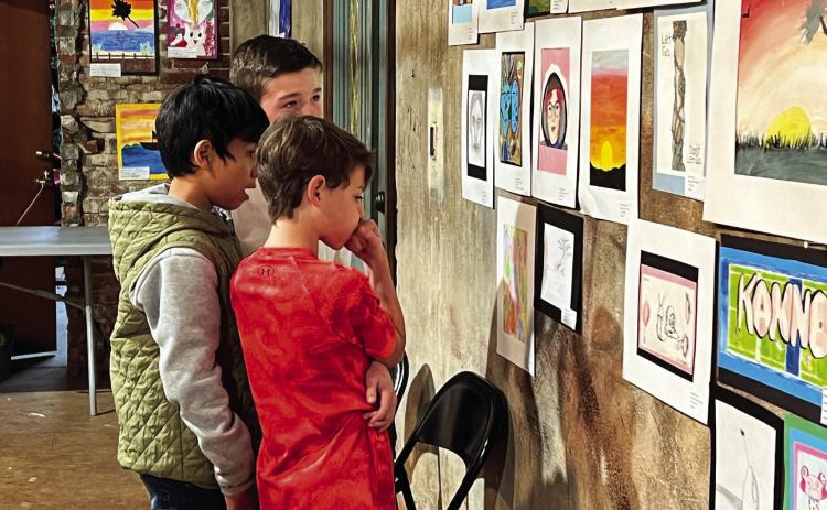 Whitebead students take in the art work on display during the Garvin County Student Art Show at the Pauls Valley Arts Council Building Friday. News Star photo by Suzanne Mackey