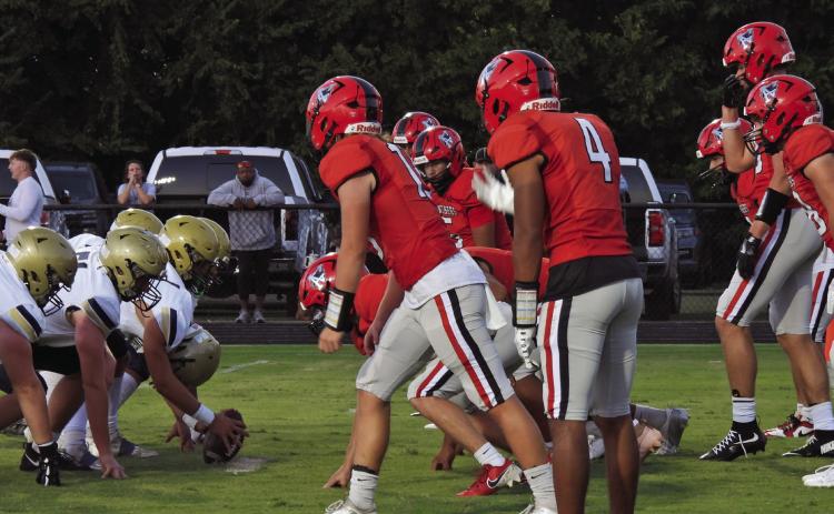 The Pauls Valley defense prepares for the ball snap in the Panthers’ fourth-quarter win over Kingfisher 43-40. News star photo by Chris Mackey