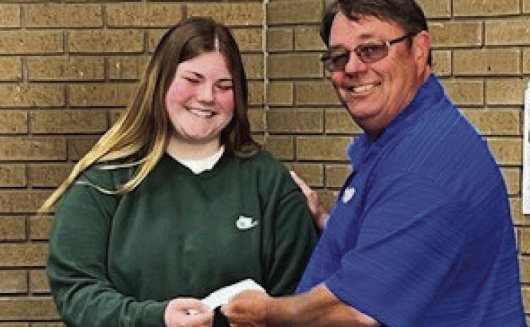 Pauls Valley Rotary Speech Contest Chair Bill McAngus presents Milo Jones with a prize check after she won second place in the organization's Four-Way Test Speech Contest April 15. Courtesy photo
