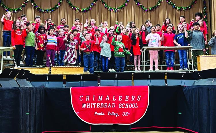 Whitebead third and fourth grade students sing a selection of Christmas tunes for staff, students and family members during Whitebead’s Christmas program Dec. 14.