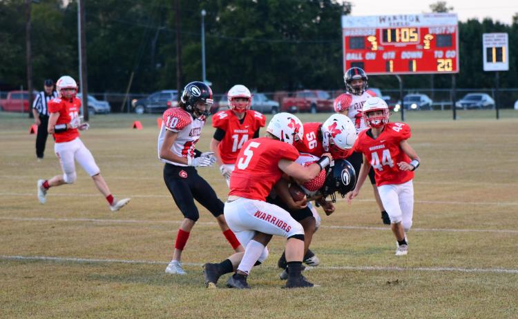 Nigel Reid and Kolby Wyatt gang tackle the Grandfield running back. Photo by Denny Park