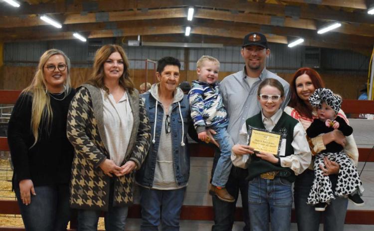 Bristol Wood received the 2022 Give It Your All award in memory of Dale and Toby Jones at the Maysville Livestock Show held Feb. 18. Pictured, left to right, are Maysville Ag Instructor Brittany Morphew, Brenda Jones, Judy Jones, Chipper Jones, Justin Jones, Bristol Wood, Jaycie Jones and Paxxley Jones. Courtesy photo