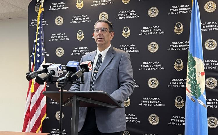 Garvin County Sheriff Jim Mullett speaks to reporters during a press conference at OSBI headquarters Friday. News Star photo by Suzanne Mackey