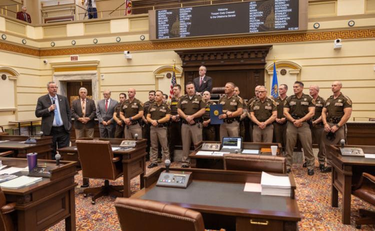 Sen. Casey Murdock, R-Felt, recognizes Trooper Cody Creswell, who is surrounded by his Oklahoma Highway Patrol colleagues on the floor of the Senate. Courtesy Photo