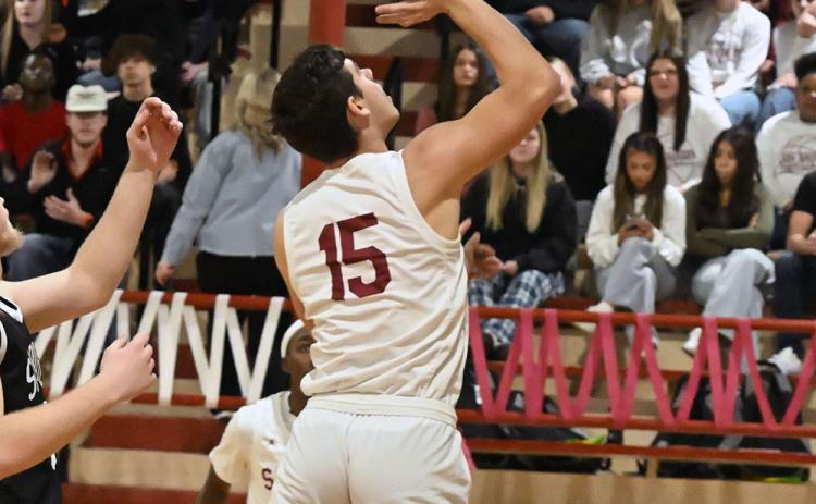 Wynnewood's Jake Everett scores against Springer. Photo by Don Coffey