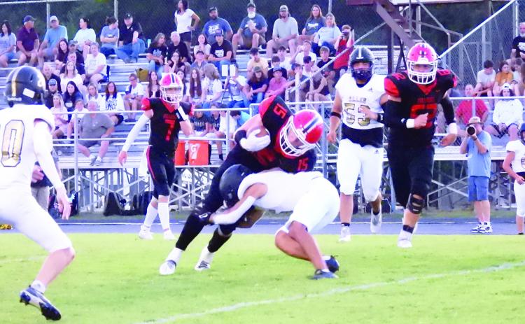 Stratford running back Walker Chandler tries to escape a tackle by the Allen defensive back during Friday's game. News Star photo by Chris Mackey