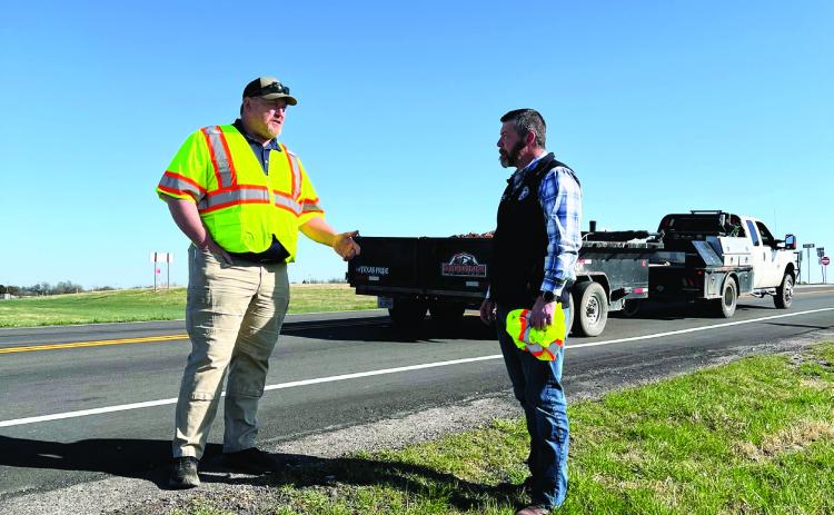 Garvin County Commissioner Tom Pyle (right) and State Senator Jonathan Wingard (left) last month at the site of a recent road resurfacing project on Airline Road near Interstate 35. News Star photo by Suzanne Mackey