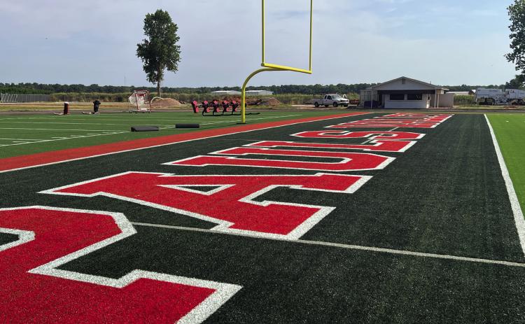 Pauls Valley‘s Thompson Field will welcome the 2026 football season with several upgrades including new artificial turf (top), a new video scoreboard (lower center), and new restrooms (lower right). Over the summer, the school district also began sanding and refinishing the floor in the basketball gym at the high school (lower left). News Star photos by Suzanne Mackey