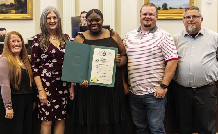 Rep. Cynthia Roe with Annika Pittman, her parents and coach. Courtesy photo