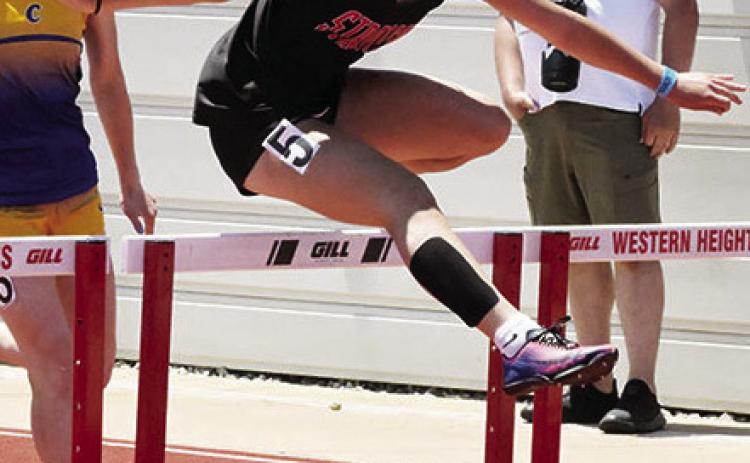 Stratford sophomore Addison Owens jumps a hurdle in the finals at the State Track Meet. News Star photo by Don Coffey
