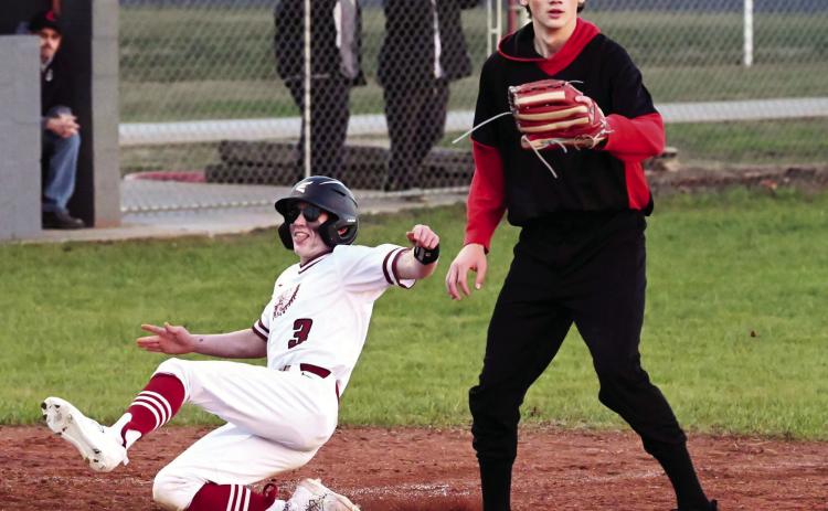Wynnewood’s Cole Beasley slides into third base in the Savages’ dominating win 24-1 over Springer March 1. The Savages beat Maud 14-3 Monday. Tuesday the Savages pulled a double header with wins over Wewoka 16-1 and Wayne 7-2 for an undefeated season opening week. News Star photo by Don Coffey