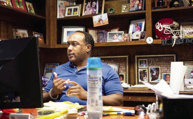 Lawton resident and former OU football player Larry Bush ran as a Democrat for House of Representatives in 2016, 2018 and 2020 losing all three times to a Republican opponent. The logo of his insurance business is the same as his former campaign. (Whitney Bryen/Oklahoma Watch)