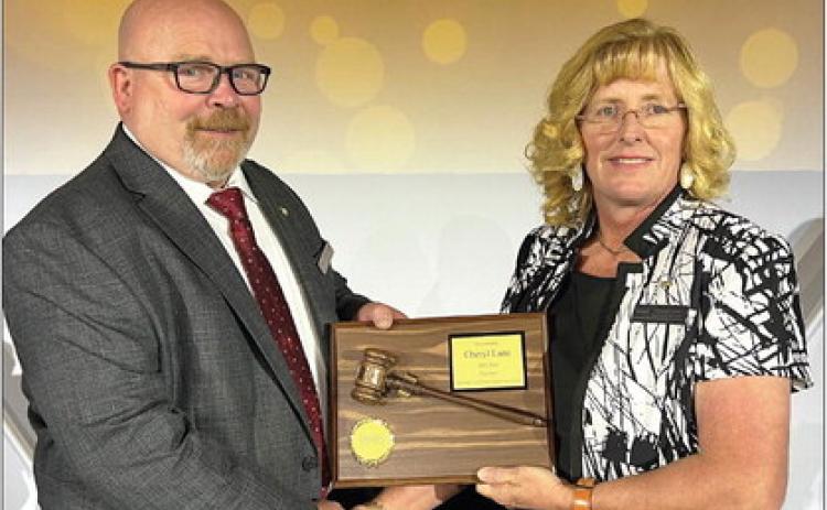Incoming Oklahoma State School Boards Association president Joe Don Looney (left) congratulates outgoing president Cheryl Lane during the OSSBA/CCOSA Education Leadership Conference in August. Photo courtesy of OSSBA