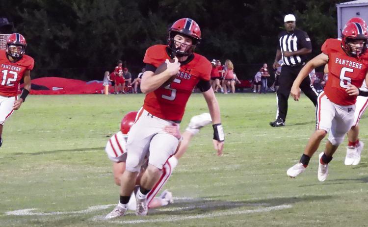 Pauls Valley’s Justin Humphrey tries to run away from a Davis Wolves defensive back during Friday’s game. The Panthers lost to Davis, 28-14. Pauls Valley will try to rebound tonight as they travel to Purcell to play against the district 2A-3 Dragons. The Panthers and Dragons have a long history of playing a good rivalry game, and this one should not be any different. Kickoff is at 7 p.m.  News Star photo by Chris Mackey