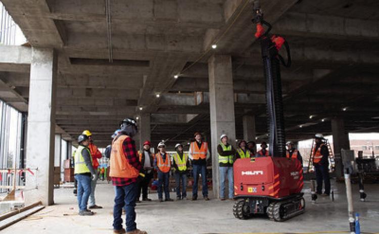 The Hilti JAIBOT robot made its Oklahoma debut at the construction site of Oklahoma State University’s New Frontiers Agricultural Hall and will be used for the next three months. A group of students from the OSU Institute of Technology in Okmulgee, Oklahoma, visited the New Frontiers site to watch the robot in action. (Photo by Mandy Gross, OSU Agricultural Communications Services)