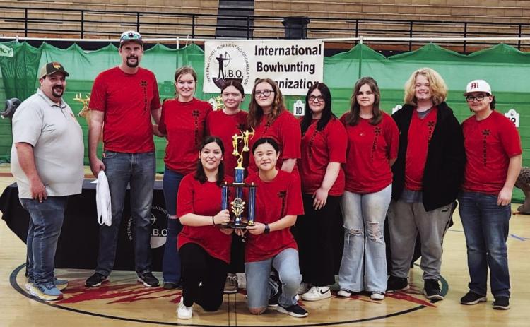 The Maysville archery team competed in the 2024 Oklahoma State NASP/IBO 3D Challenge tournament in McLoud March 2, where they placed third out of eight teams shooting in the high school division. From left: NASP/IBO official, team coach Bradley Uhles, Madison Hunter, Racy Wigley, Addison Welch, Karissa Hammond, Mya Darnell, Mason Darnell and David Steakley. Kneeling in front are Samantha Landeros and Marissa Moates. Courtesy photo