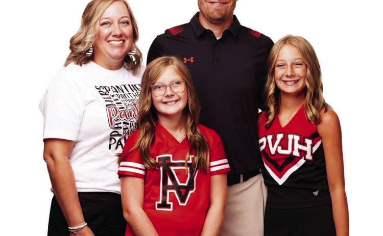 Pauls Valley Cross Country Coach Jason Schroeder with his wife, Chelsey, and their two daughters. Courtesy Photo