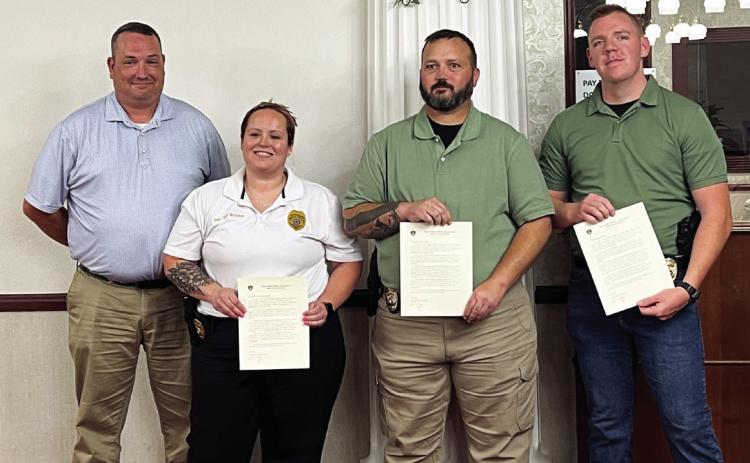 Pauls Valley Police Chief Don May (left) recognized (l-r) Asst. Chief Brittany McGehee, Sgt. Heath Chappell and Officer Zachary Mackey with letters of commendation during Tuesday’s council meeting.