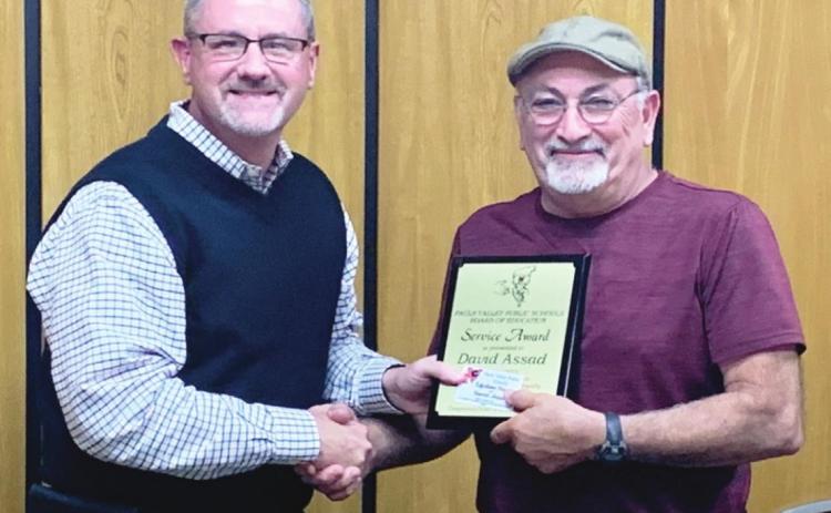 Pauls Valley Superintendent Mike Martin presents School Board President David Assad with a Five-Year Service Award.
