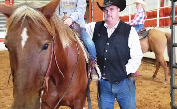 Highly-trained cowboy fashion reporter Shawn Williams, his granddaughter Miya Johnson and “Cheech.” Submitted photo