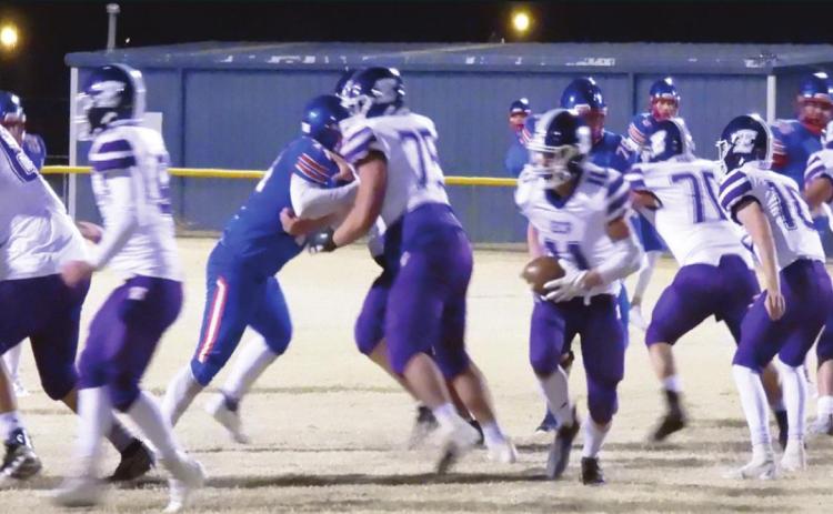 Badger Hunter Burger looks for an opening in the Eagles’ defensive line to run the ball in last Friday's game. Photo by Chris Mackey