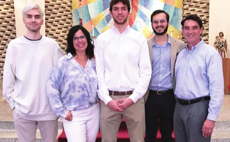 ECU President Wendell Godwin poses with his wife and three sons at St. Joseph’s Catholic Church in Ada. From left are Adam, Susie, Sam, Ben and Wendell. Courtesy Photo