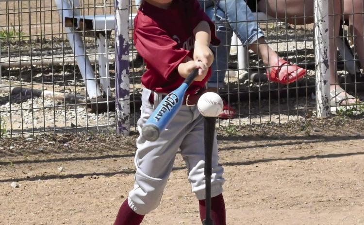 A Wynnewood Savage T-ball batter lines up for a big swing during a recent game. News Star photo by Don Coffey
