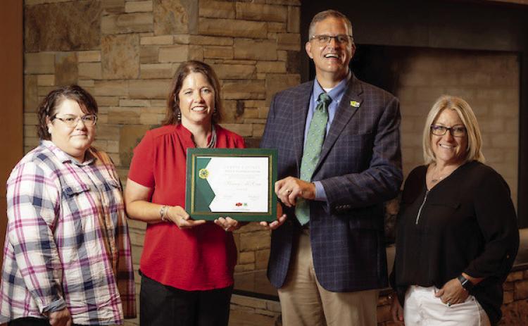 Stacey McCaa of Elmore City was recently recognized as the Garvin County 4-H Volunteer of the Year. McCaa serves as the Elmore City 4-H Club leader and Shooting Sports Club leader for Garvin County. Pictured left to right are Tracie Mullendore, Garvin County OSU Extension program assistant; McCaa; Steve Beck, State 4-H Program Leader; and Melissa Koesler, Garvin County OSU Extension director.