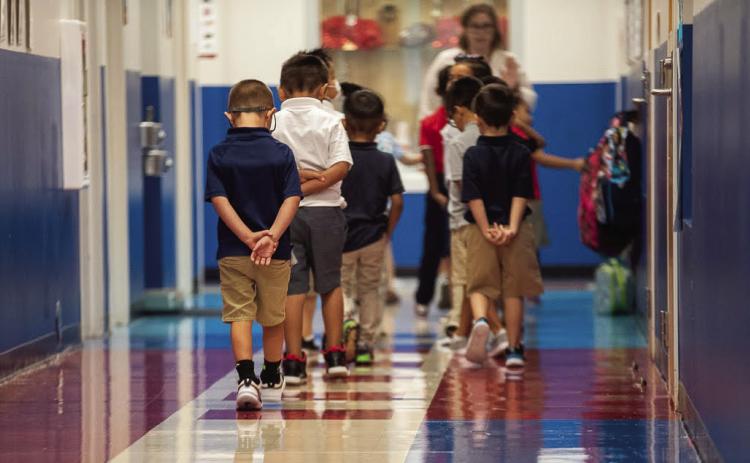 Students walked the halls of Monroe Elementary School in Oklahoma City on the morning of Aug. 11, 2022, the first day of school. (Whitney Bryen/Oklahoma Watch)