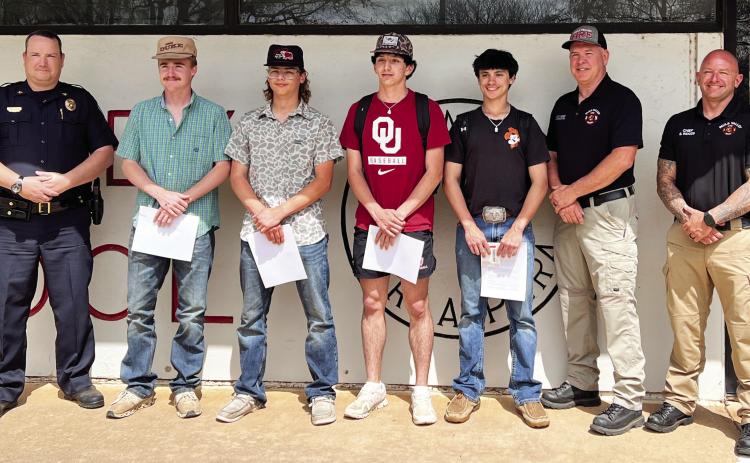From left, Pauls Valley Police Chief Don May, Ketch Johnson, Logan Schaper, Zack Hayes, Braxton Brumley, Pauls Valley Assistant Fire Chief Marcus Hamilton and Fire Chief Scott Woods. News Star photo by Suzanne Mackey
